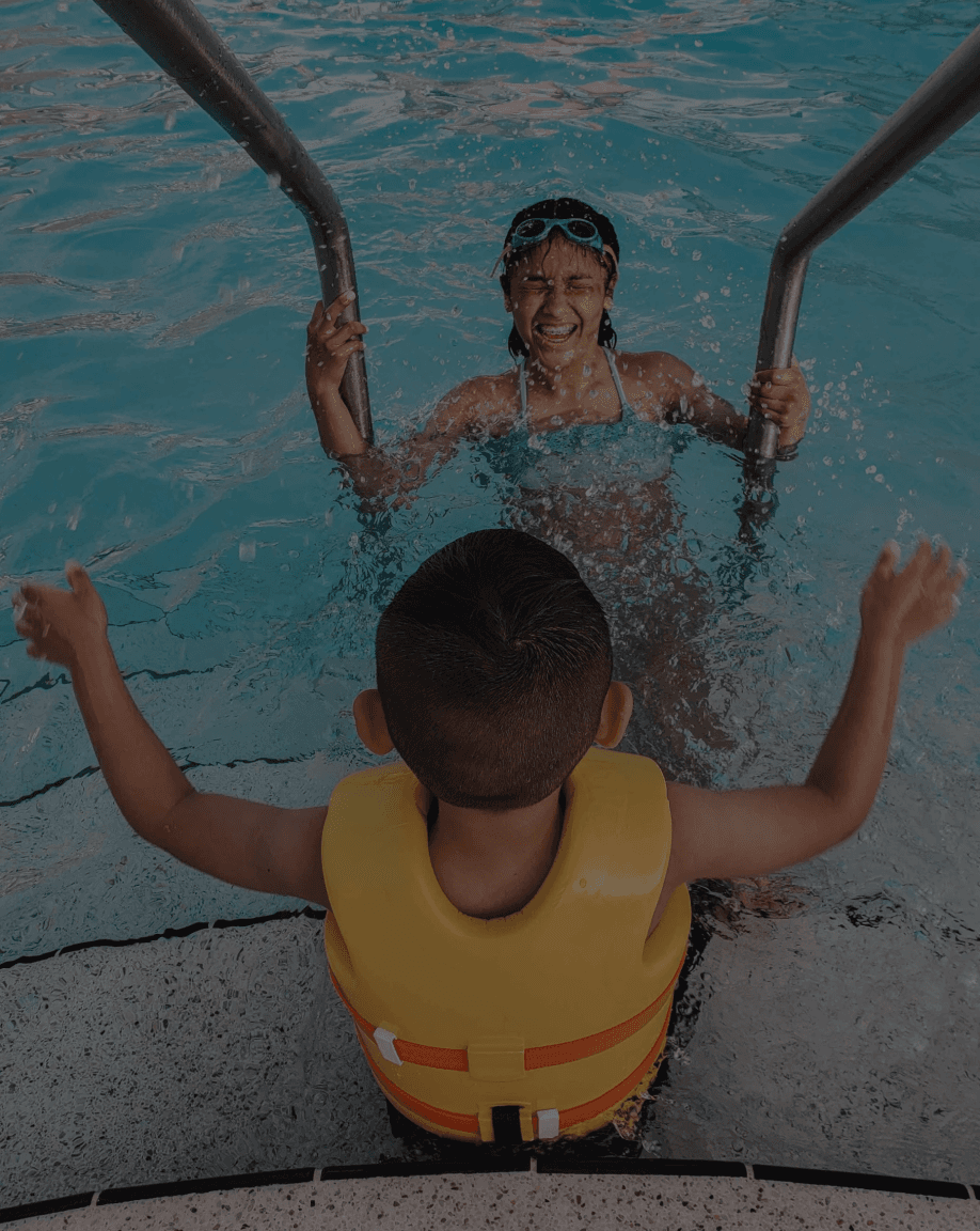 Child at the pool stairs